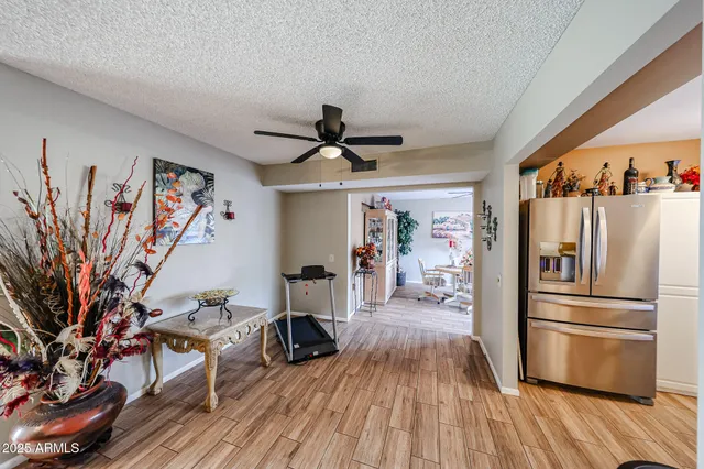 a kitchen with stainless steel appliances a refrigerator and a stove top oven