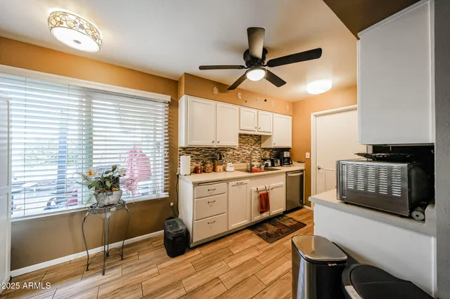 a kitchen with stainless steel appliances kitchen island granite countertop a stove and a refrigerator
