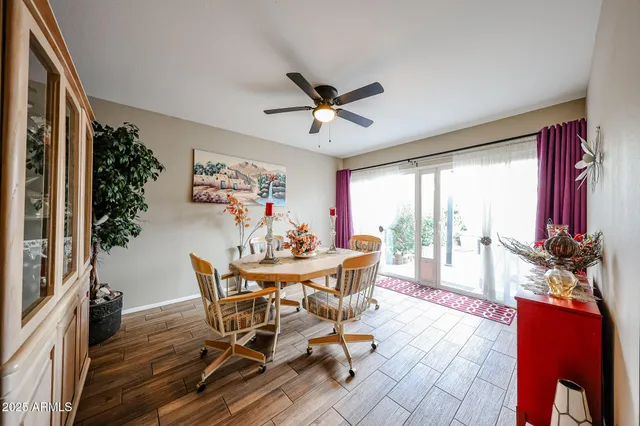 a bed room with two bed and a lamp