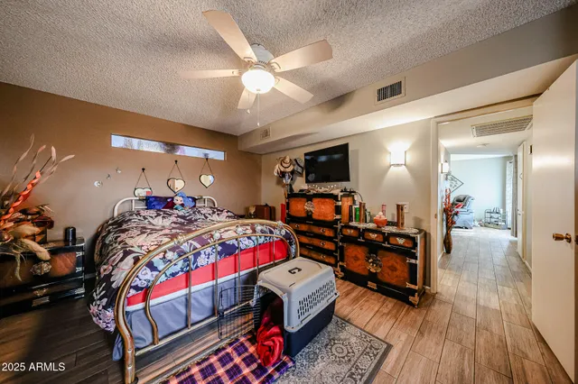 a bathroom with a sink vanity mirror and toilet