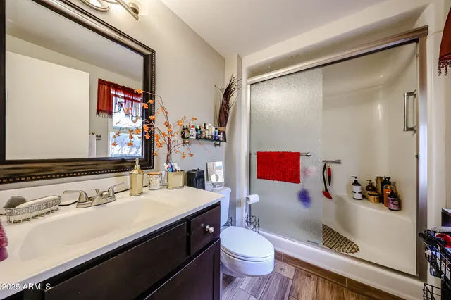 a living room with furniture a flat screen tv and gym equipment
