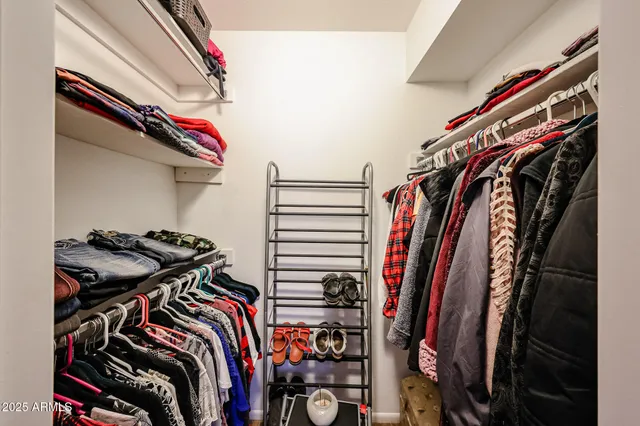 a bedroom with furniture and a chandelier