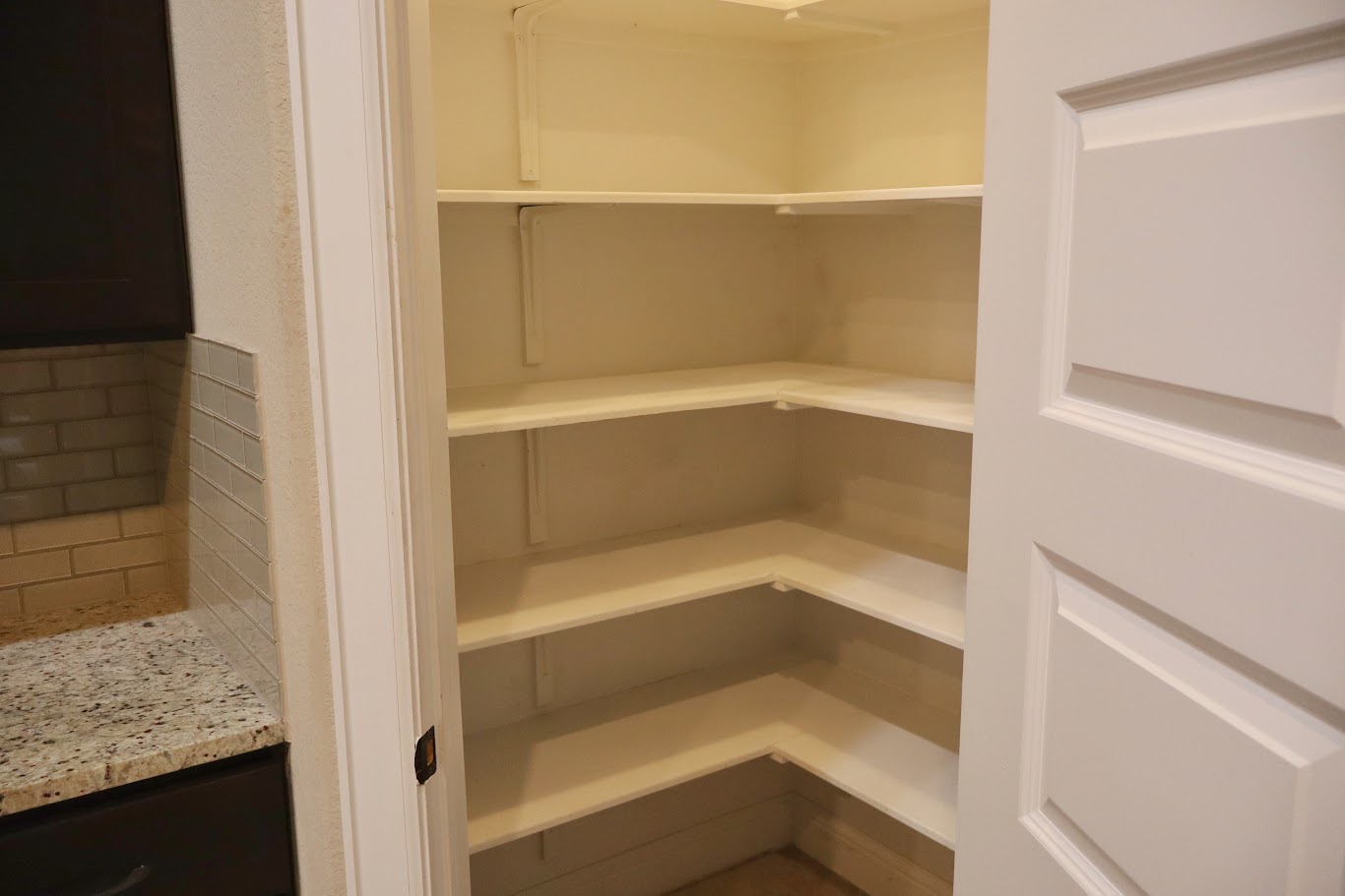 1509 Highland Ridge Road Georgetown, TX 78628 - Photo 22 of 28 Ample storage awaits in this well-appointed pantry, offering convenient access to the adjacent kitchen.