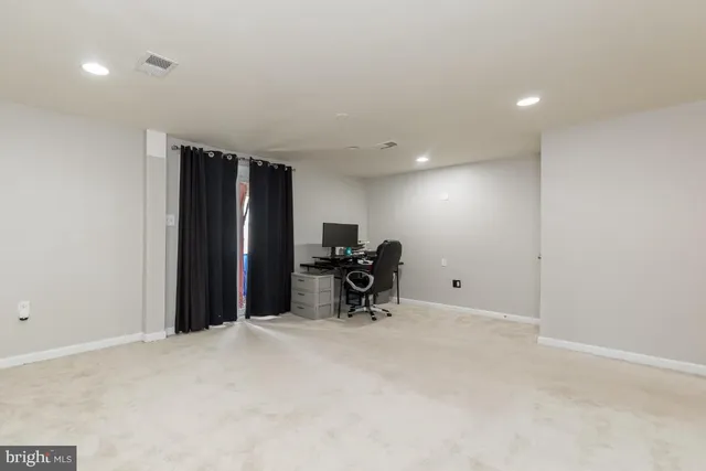 a room with window and pool table