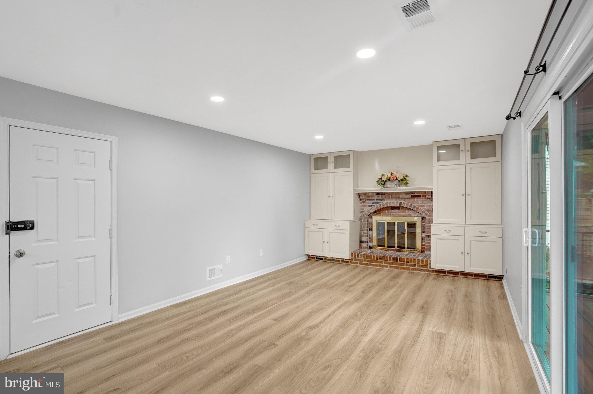 8298 Lindside Way Springfield, VA 22153 - Photo 15 of 38 a view of a livingroom with a hard wood floor