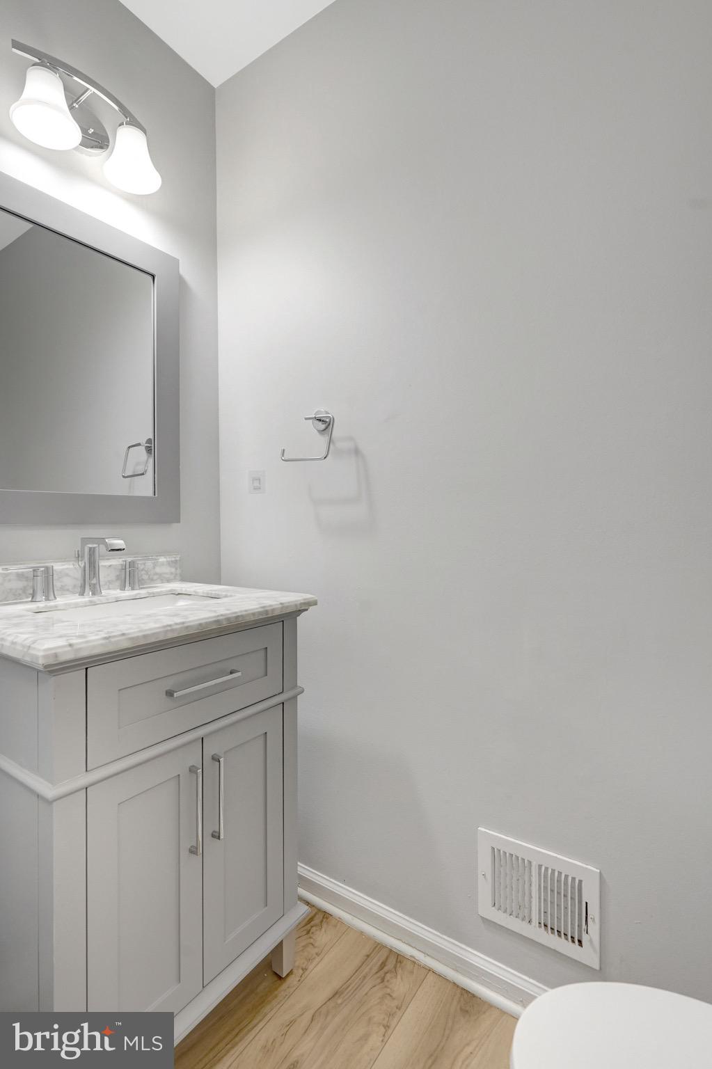 8298 Lindside Way Springfield, VA 22153 - Photo 17 of 38 a bathroom with a sink and a mirror