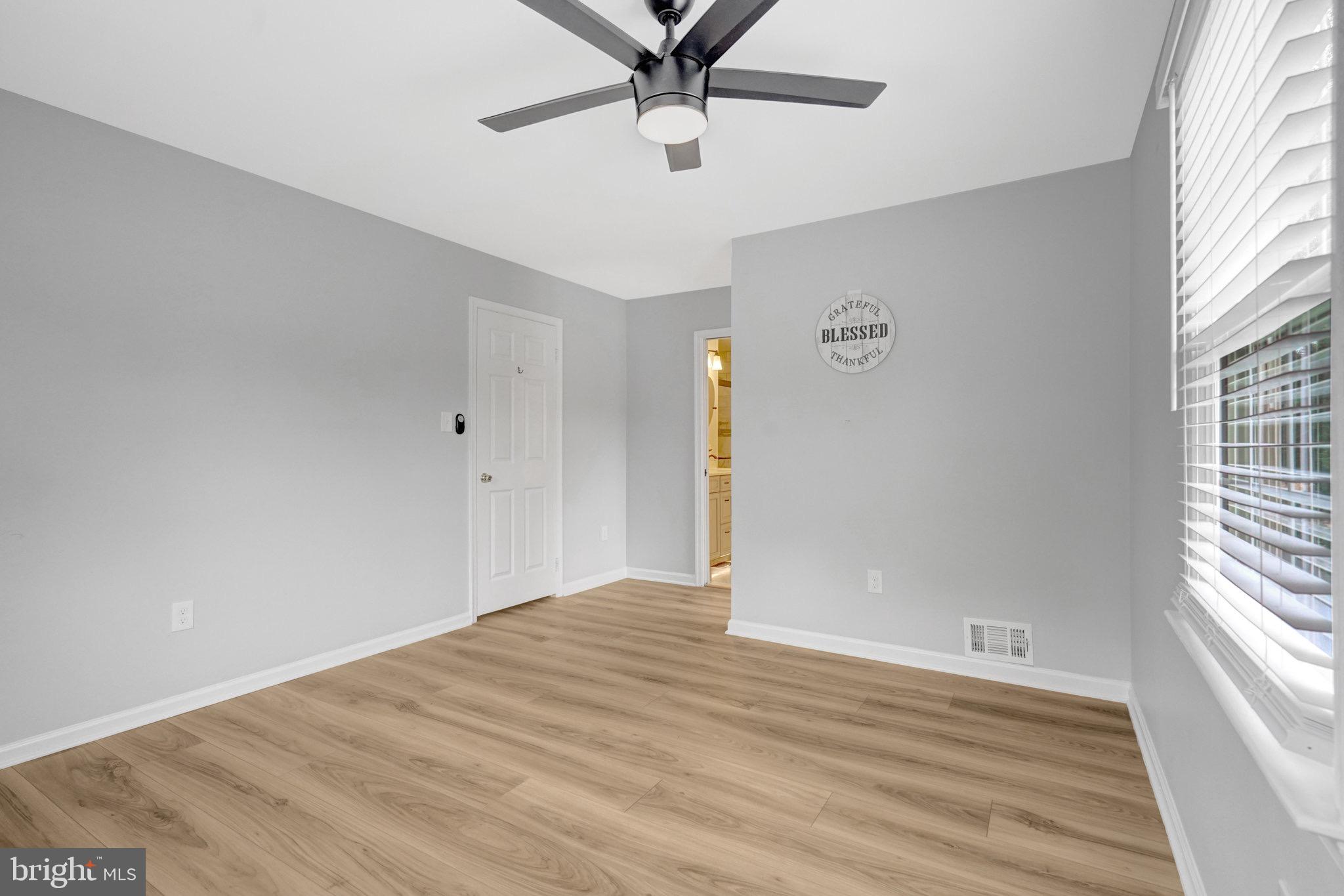 8298 Lindside Way Springfield, VA 22153 - Photo 23 of 38 a view of an empty room with a window