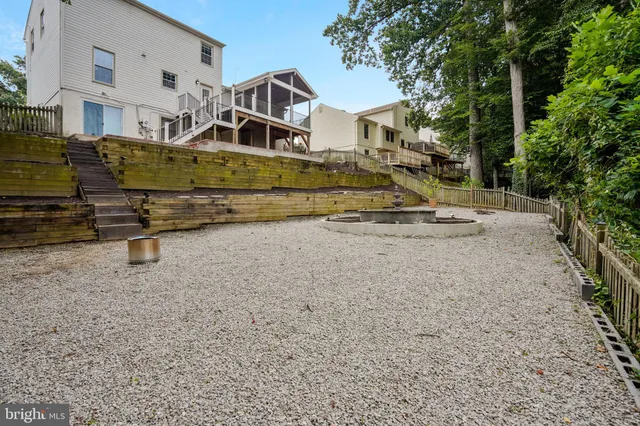 a view of a house with a yard and sitting area