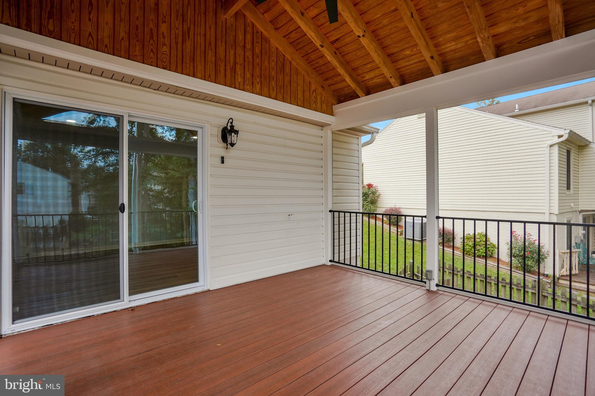 8298 Lindside Way Springfield, VA 22153 - Photo 4 of 38 a view of backyard with porch