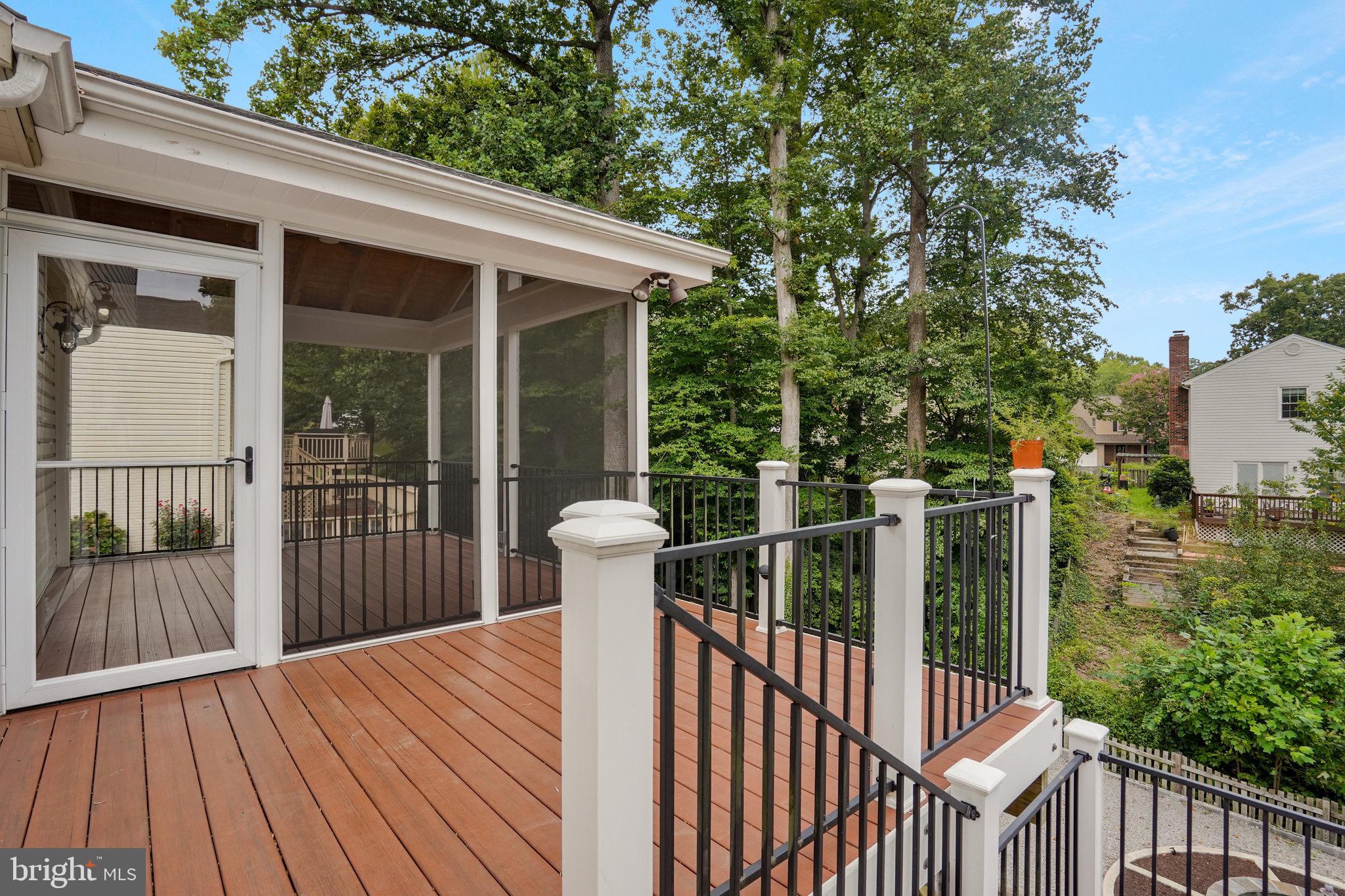 8298 Lindside Way Springfield, VA 22153 - Photo 5 of 38 a view of a balcony with wooden floor
