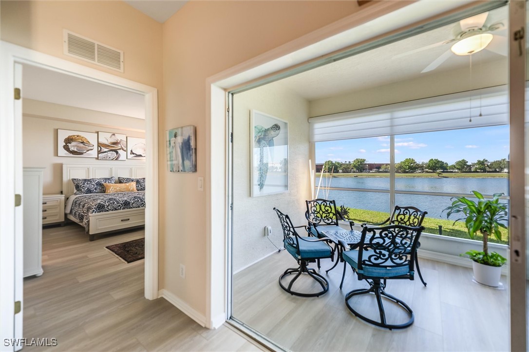 4306 Bellasol Circle, Unit 3412 Fort Myers, FL 33916 - Photo 17 of 31 a dining room with furniture and a floor to ceiling window