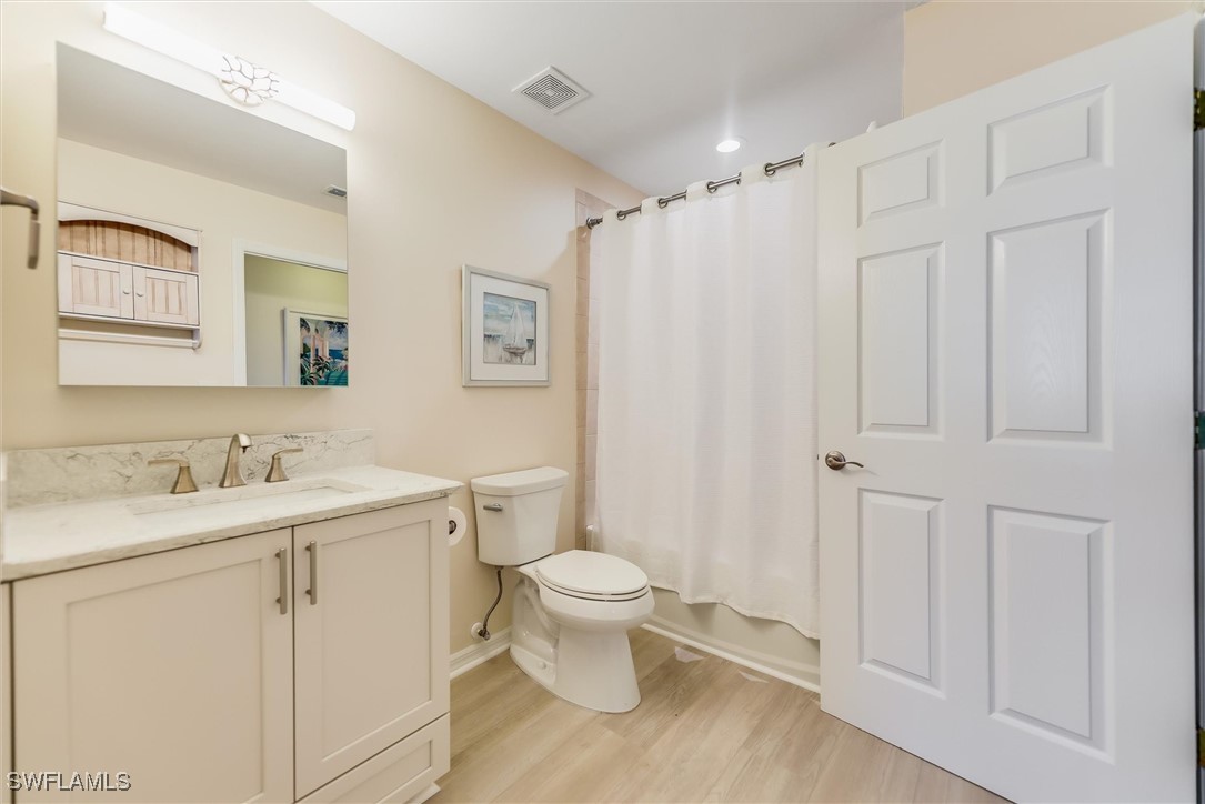 4306 Bellasol Circle, Unit 3412 Fort Myers, FL 33916 - Photo 25 of 31 a bathroom with a toilet sink and mirror