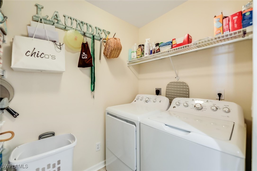 4306 Bellasol Circle, Unit 3412 Fort Myers, FL 33916 - Photo 27 of 31 a utility room with dryer and washer