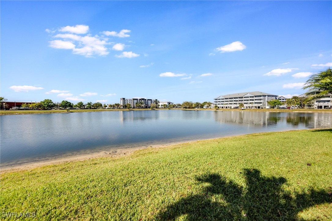4306 Bellasol Circle, Unit 3412 Fort Myers, FL 33916 - Photo 4 of 31 a view of a lake with a city