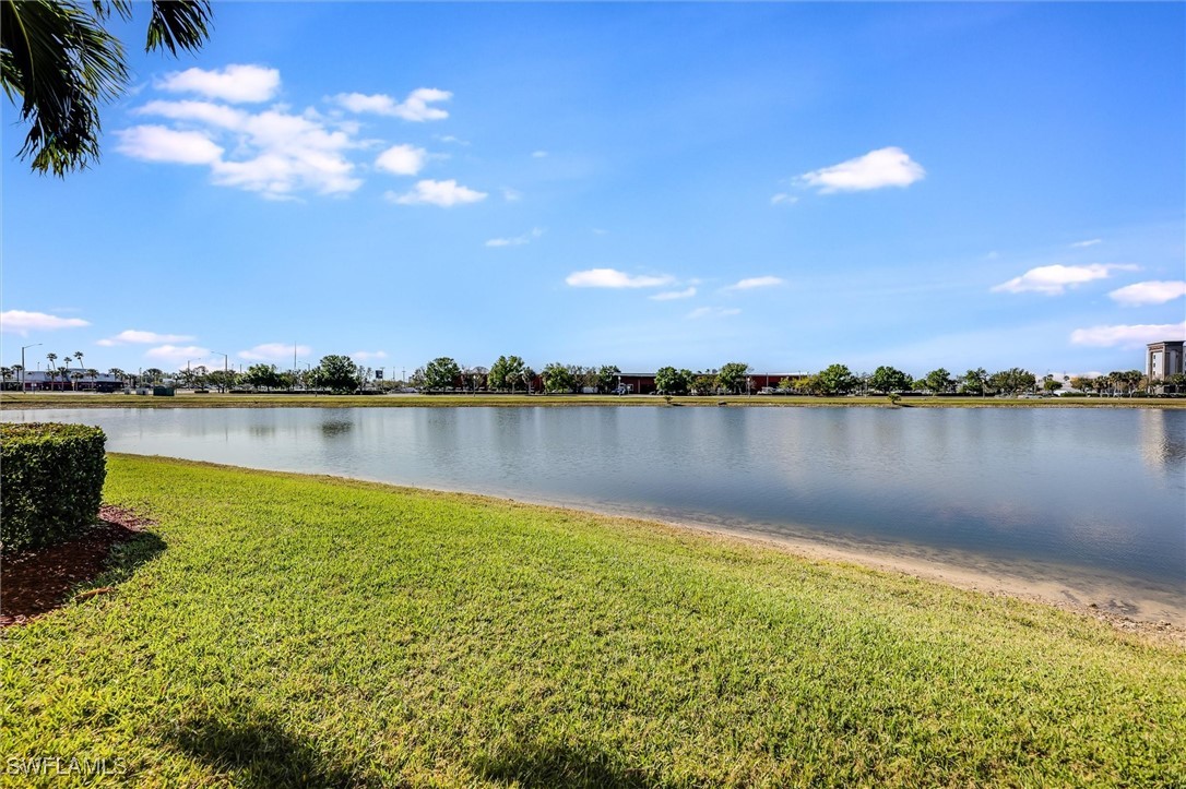 4306 Bellasol Circle, Unit 3412 Fort Myers, FL 33916 - Photo 5 of 31 a view of a lake with houses in the back