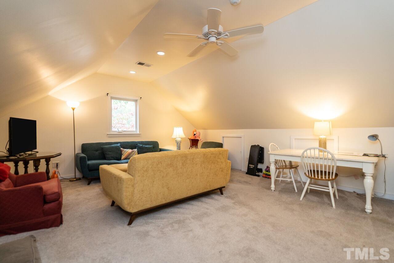 1117 Cowper Drive Raleigh, NC 27608 - Photo 19 of 28 a living room with furniture and a flat screen tv