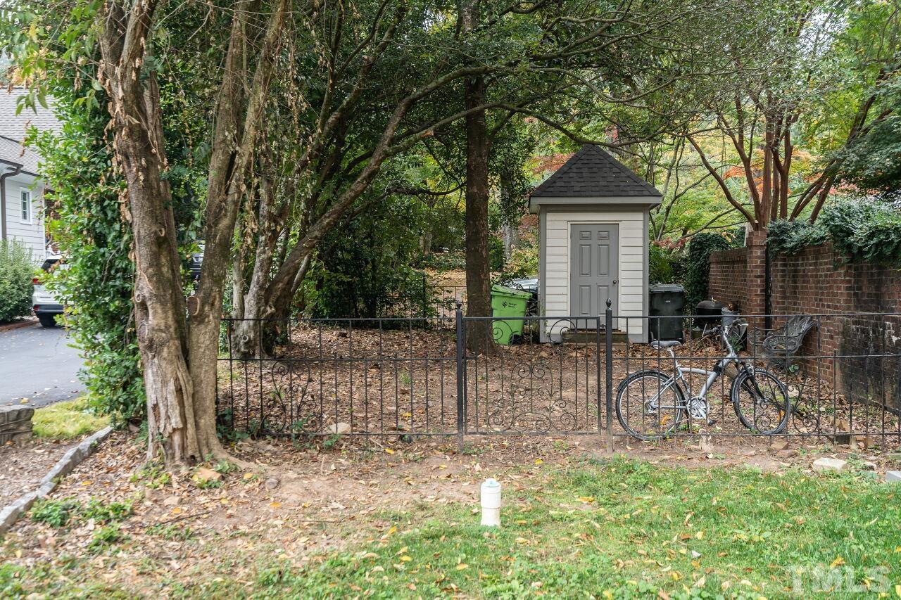 1117 Cowper Drive Raleigh, NC 27608 - Photo 24 of 28 a front view of a house with a yard