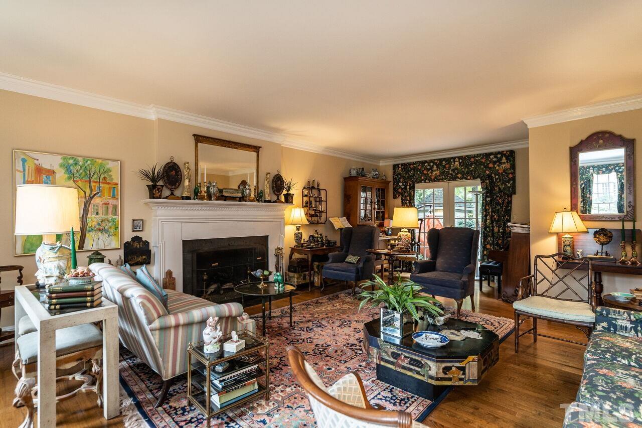 1117 Cowper Drive Raleigh, NC 27608 - Photo 5 of 28 a living room with furniture and a fireplace