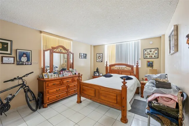 a bedroom with bed and window