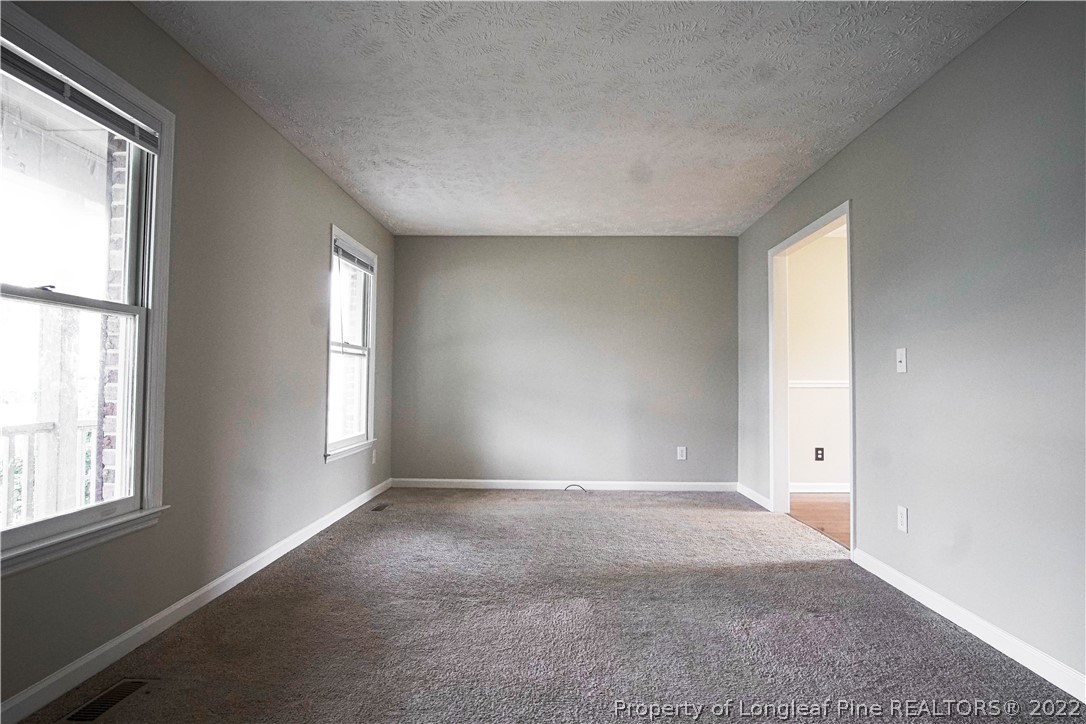 1810 Nuthatch Road Fayetteville, NC 28304 - Photo 20 of 37 an empty room with windows