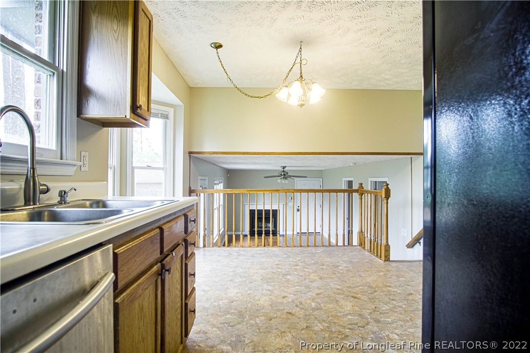 1810 Nuthatch Road Fayetteville, NC 28304 - Photo 3 of 37 a kitchen with a sink and a refrigerator
