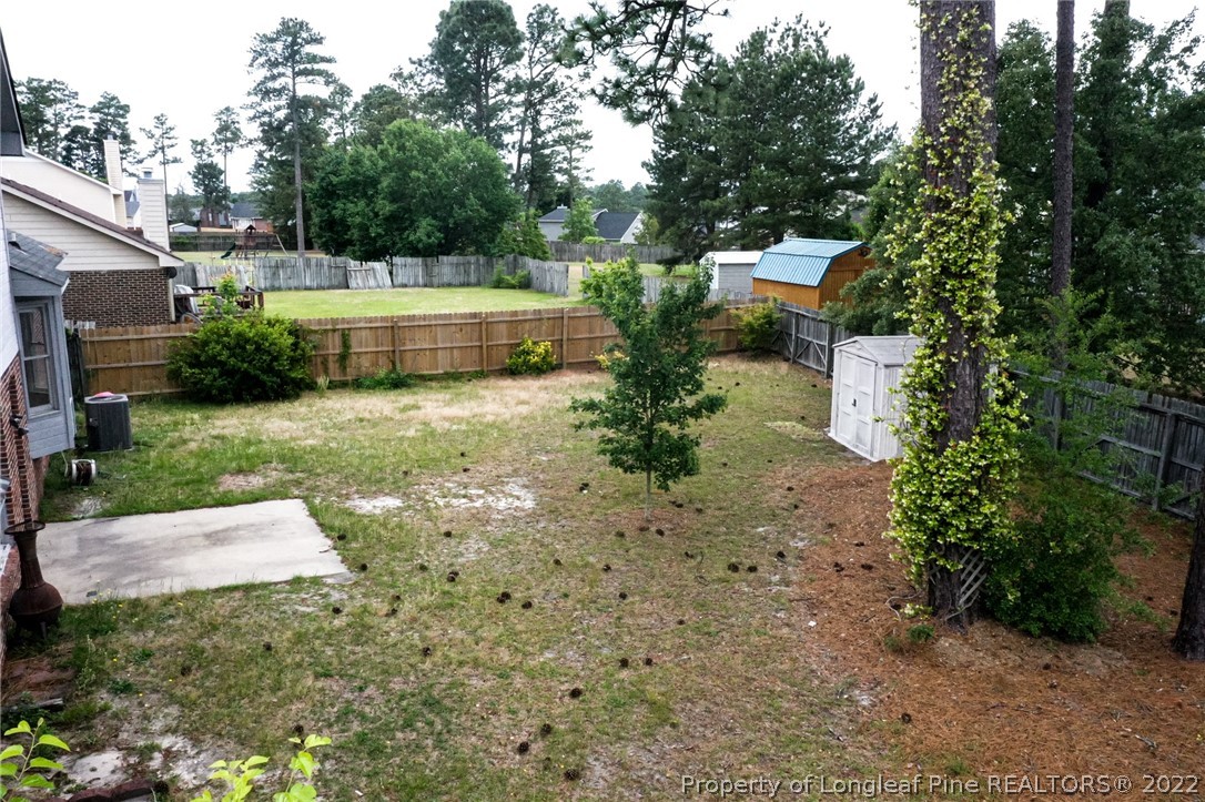1810 Nuthatch Road Fayetteville, NC 28304 - Photo 35 of 37 a view of backyard with swimming pool and green space