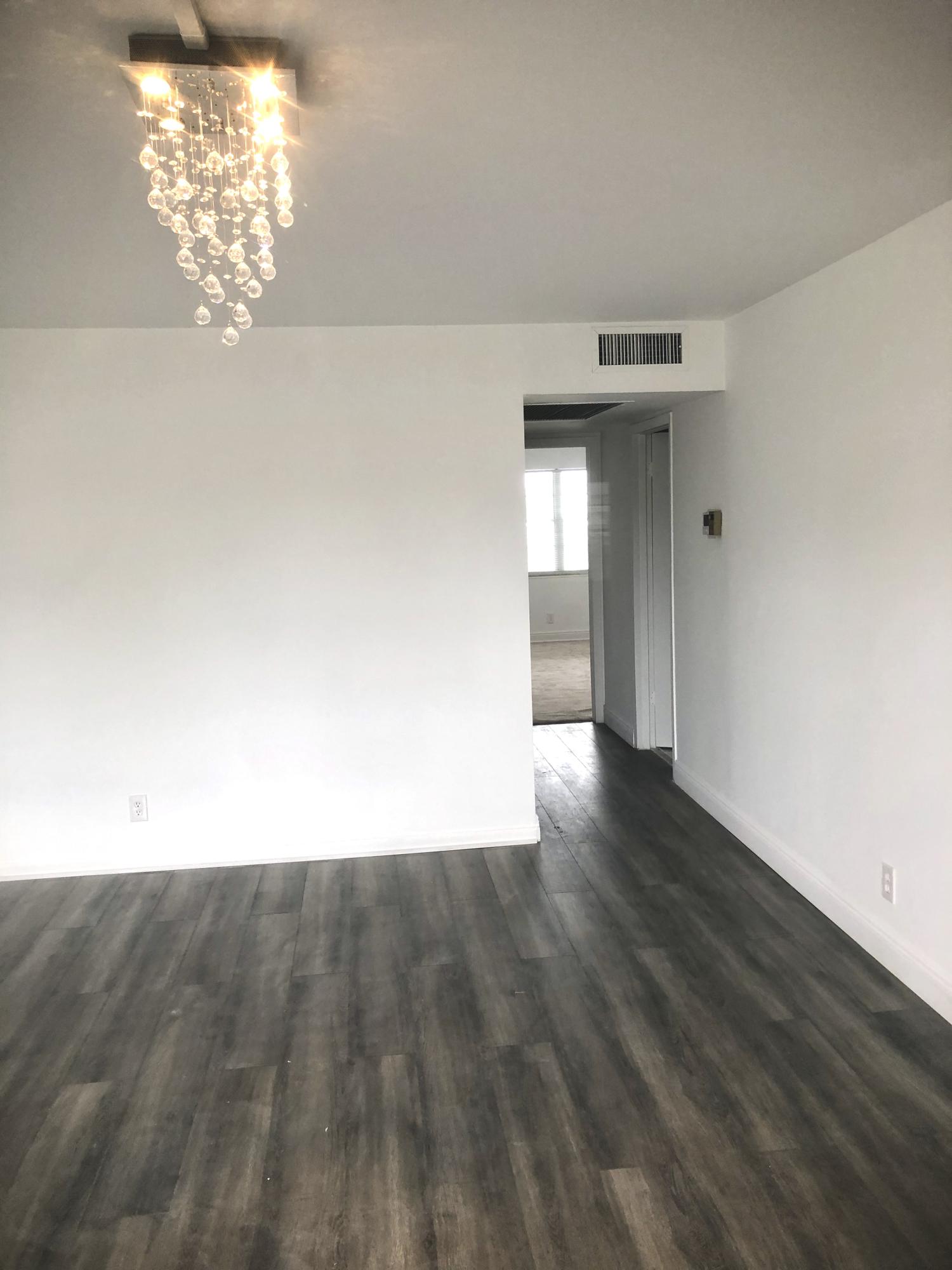 3067 Guildford East Boca Raton, FL 33434 - Photo 7 of 31 living room to hallway