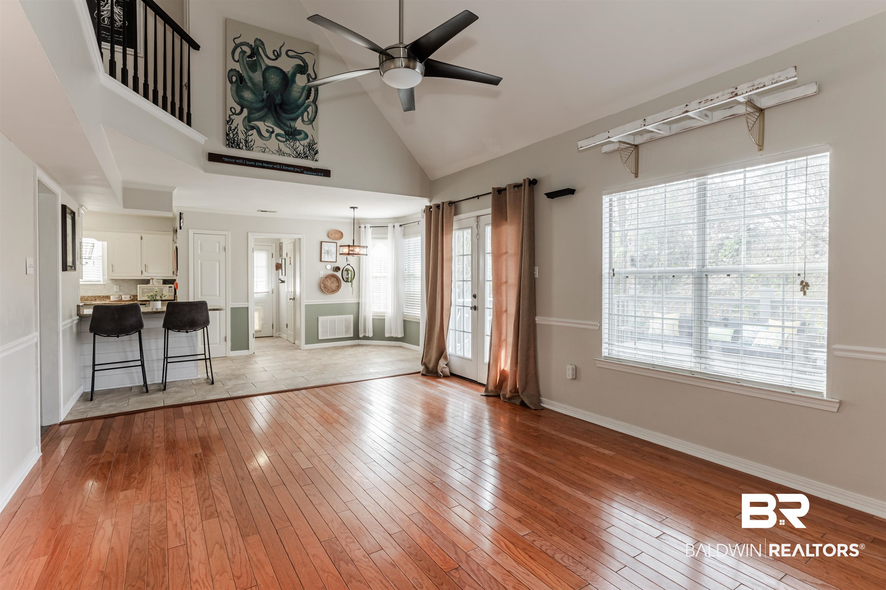 3844 Isabel Way South Mobile, AL 36693 - Photo 16 of 49 Unfurnished living room featuring high vaulted ceiling, ceiling fan, and light wood-type flooring