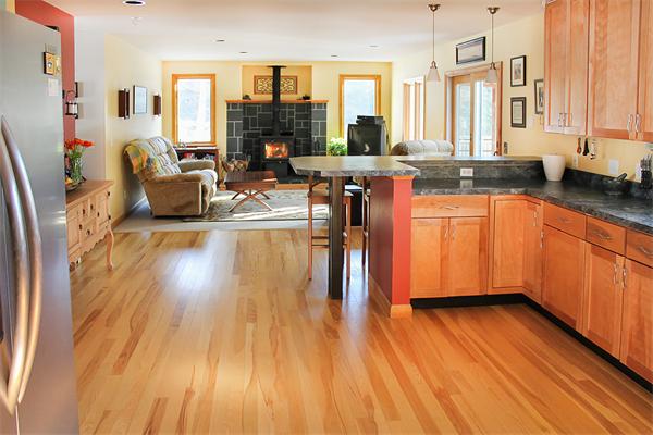 93 Lower Pomeroy Road Montgomery, MA 01085 - Photo 10 of 20 a kitchen with stainless steel appliances granite countertop wooden floors a refrigerator and a stove