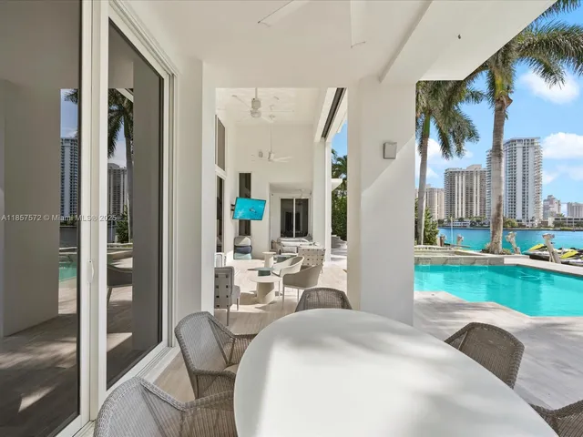 an aerial view of multiple houses with outdoor space