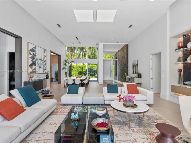 a bathroom with a double vanity sink a mirror and a shower