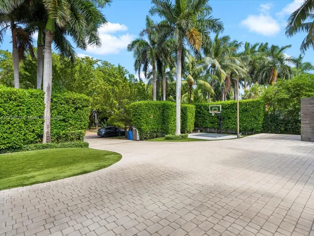 a view of a house with swimming pool and porch with furniture