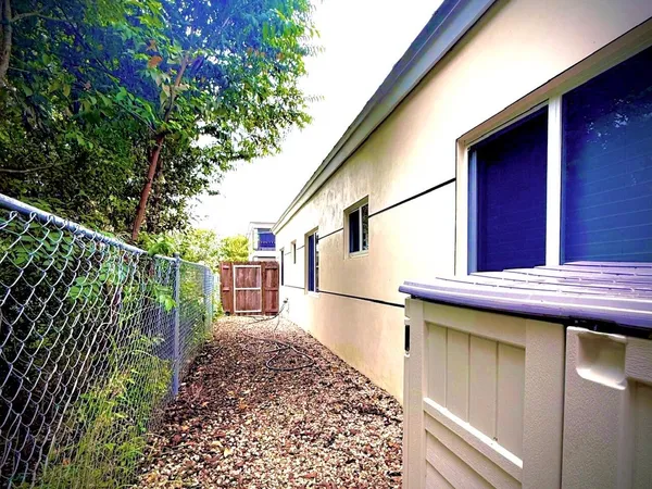 a view of a backyard with a small cabin