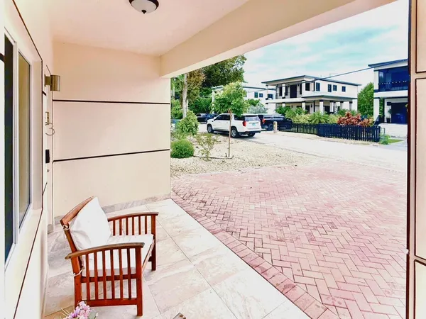 a view of a street with a building in the background