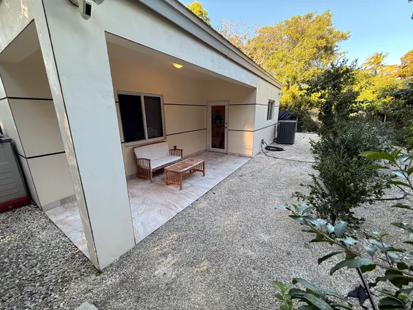 a view of a back yard of the house