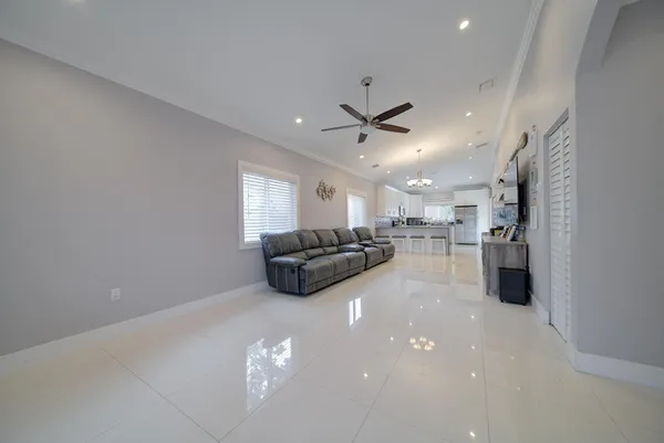 a kitchen with furniture and a chandelier
