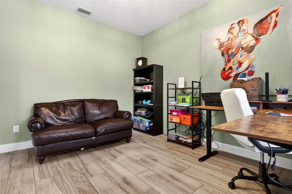 4895 State Rte 100 Bunnell, FL 32110 - Photo 13 of 45 a living room with furniture and wooden floor