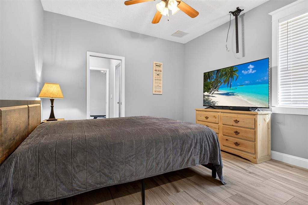 4895 State Rte 100 Bunnell, FL 32110 - Photo 33 of 45 a bedroom with a bed and a flat screen tv