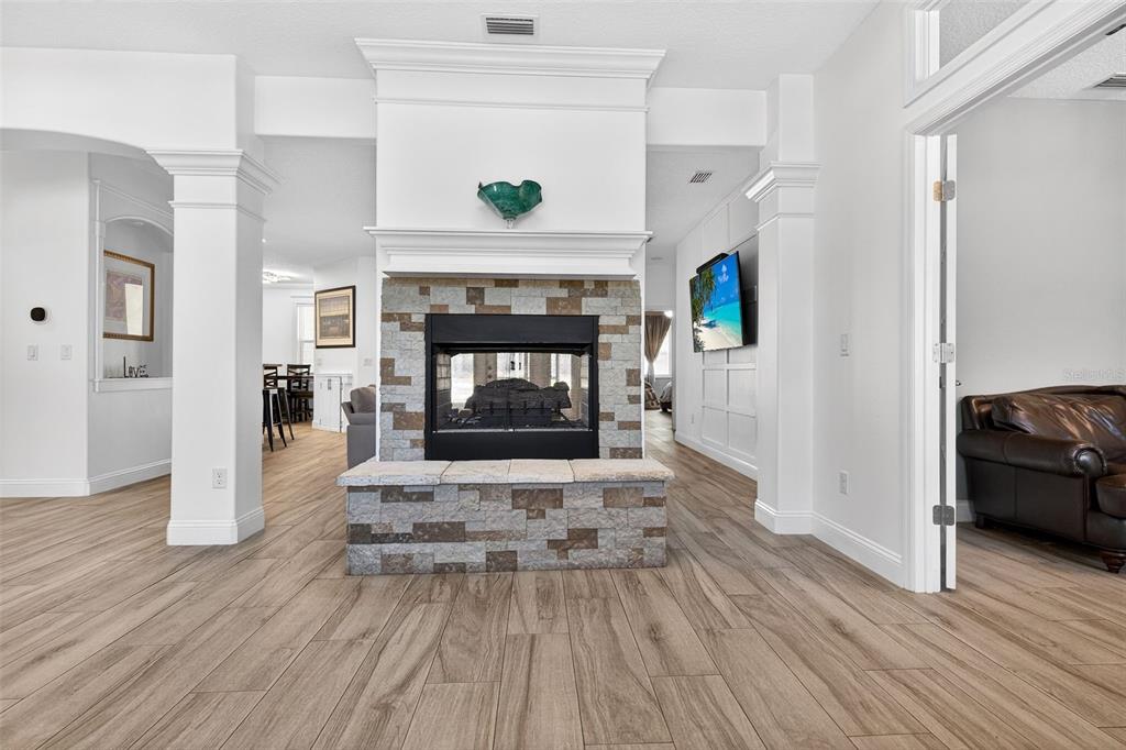 4895 State Rte 100 Bunnell, FL 32110 - Photo 5 of 45 a living room with furniture and a fireplace