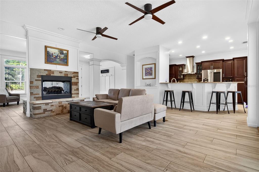 4895 State Rte 100 Bunnell, FL 32110 - Photo 9 of 45 a living room with furniture and a fireplace