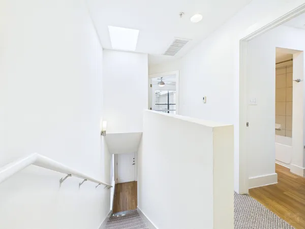 a view of a bathroom from a hallway