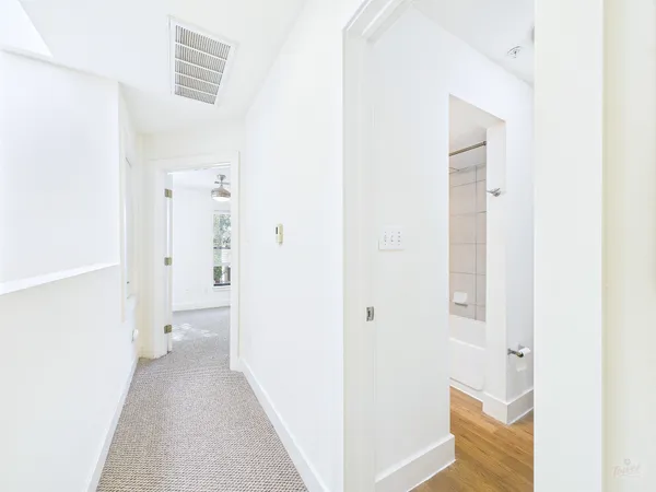 a view of an empty room with a window