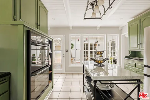 a view of a kitchen with furniture and a kitchen