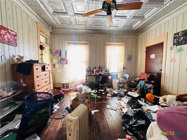 a bedroom with furniture and a window