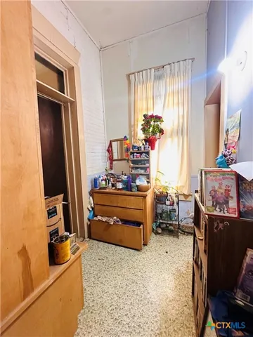 a room with furniture and a window