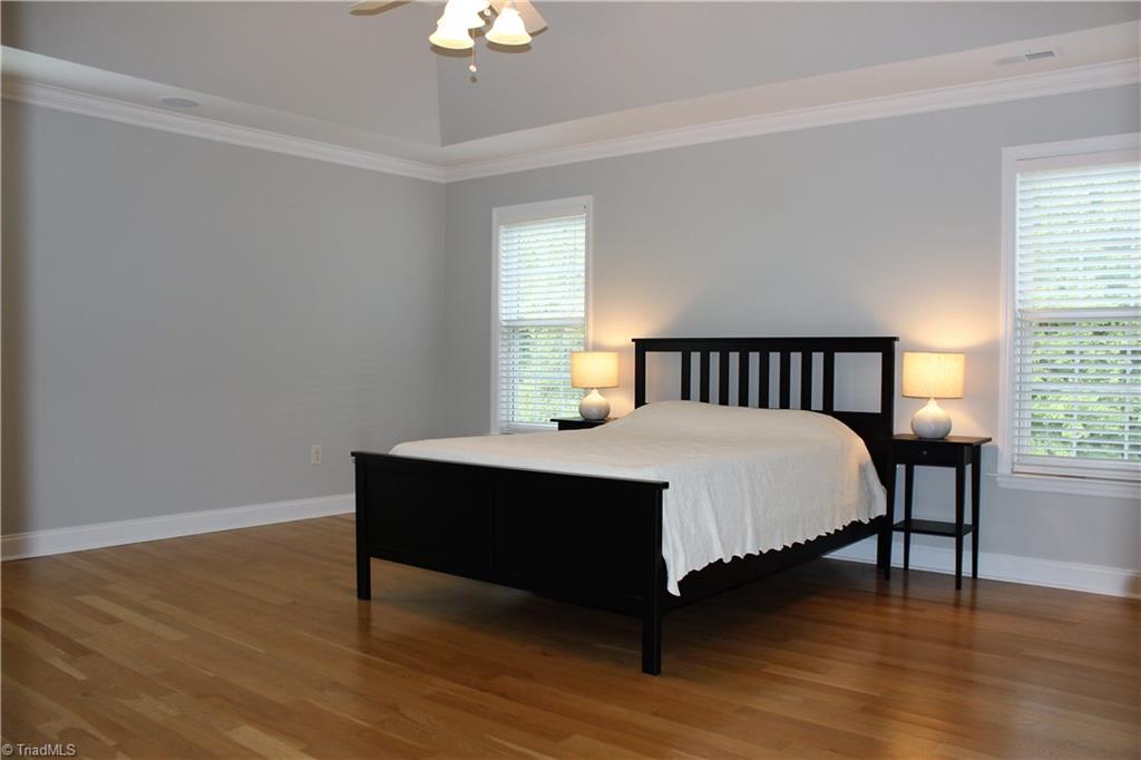 7820 Wilson Farm Road Summerfield, NC 27358 - Photo 14 of 29 Spacious Master Bedroom with Tray Ceiling, Hardwood Floors and Walk-in Closet!