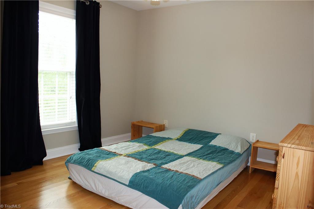 7820 Wilson Farm Road Summerfield, NC 27358 - Photo 17 of 29 2nd Bedroom with Hardwood Floors & nice size closet!