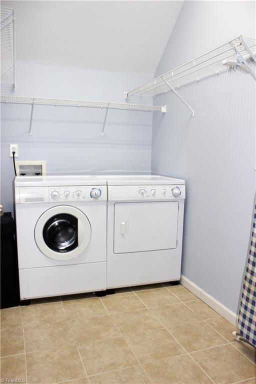 7820 Wilson Farm Road Summerfield, NC 27358 - Photo 22 of 29 Great Laundry Room with Shelving & tiled Floor!
