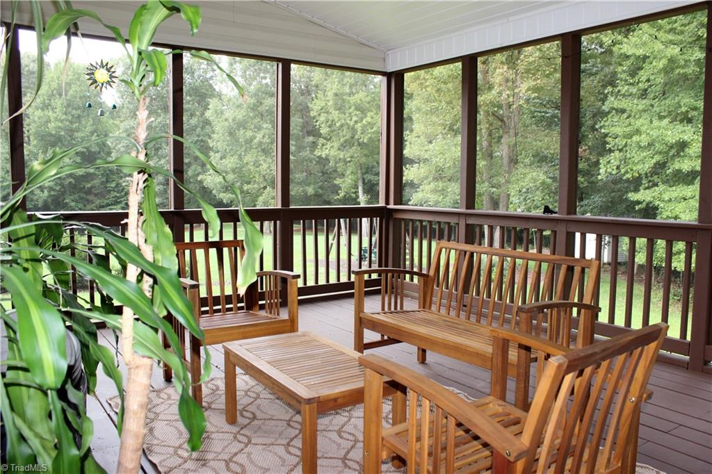 7820 Wilson Farm Road Summerfield, NC 27358 - Photo 23 of 29 Inviting Screened Porch overlooks private backyard!