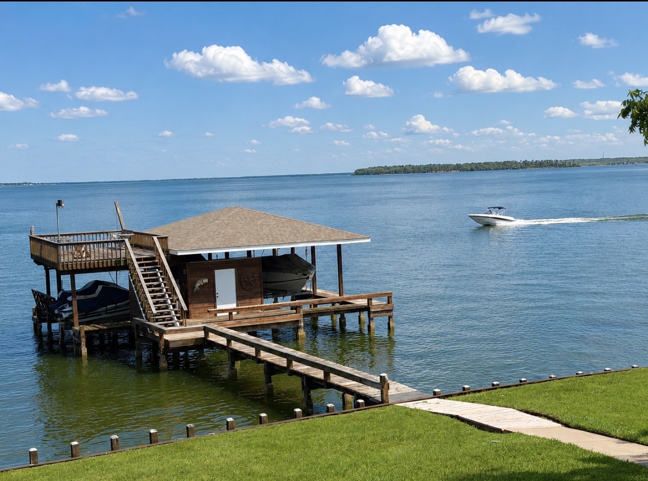430 Fawn Road Livingston, TX 77351 - Photo 33 of 47 a roof deck with table and chairs a barbeque with wooden floor